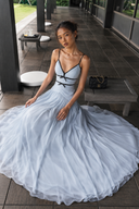 Detail view of the Vogsion Célestine flowing blue chiffon-style maxi skirt, showing the soft airy fabric, light blue color, and romantic movement