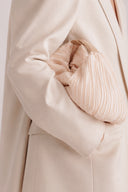 Cloudshell Convertible Mini Hobo Bag in Creamy featuring sculptural pleated cloud-inspired silhouette and minimalist top handle.