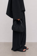 Black Cloudshell Convertible Mini Hobo Bag with sculptural pleated texture and comfortable top handle.