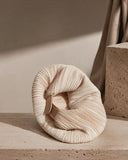 Creamy pleated Cloudshell Convertible Mini Hobo Bag inspired by seashell curves and modern sculptural design.