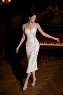 Eirene white shell-pleated satin lace midi dress, full-body movement view