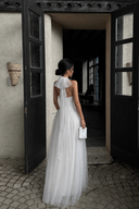 Back view of Vogsion Elara Petite Ivory Tulle Corset Maxi Dress with halter scarf detail and shortened skirt length for petite women