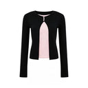 VOGSION Elina black petite faux-layer long sleeve top with pink inset, front product view on white