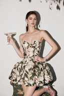 VOGSION Élodie Garden Green petite floral sequin corset bubble mini dress front view with coupe glass