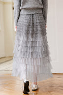 Back view of the VOGSION Elowenne grey ombre tiered tulle maxi skirt
