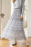 Close view of the layered grey ombre tulle ruffles on the VOGSION Elowenne maxi skirt