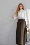 Full-length view of the VOGSION Elowyn white cotton blouse and dark brown petite maxi skirt