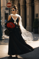 Full-length street-style view of the Vogsion Éternelle black and white maxi dress with built-in bra, crystal brooch, contrast V-neck bodice and flowing skirt.
