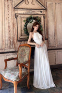 VOGSION Ivory pearl halter maxi dress with ruched waist, front view