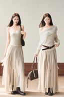 Two models wearing the VOGSION khaki petite A-line maxi dress alone and layered with an apricot off-shoulder knit sweater