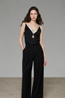 Petite-friendly black contrast layered camisole top with semi-sheer matcha green V-neck insert, front view