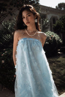 Close-up of the Vogsion Light Blue Fairycore 3D Floral Appliqué Tulle Fairy Princess Dress featuring delicate floral appliqués, sheer layered tulle, soft blue fairy dress, romantic princess aesthetic, ethereal bridal shower and garden party outfit.