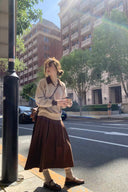 Full outfit showing Marlowe petite contrast-collar sweater styled with a brown midi skirt