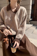Close-up of oatmeal speckled knit and cocoa contrast collar and cuffs on the Marlowe petite sweater