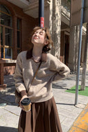 Standing view of the Marlowe petite faux-layer wool-blend sweater styled with a brown skirt