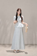 Front full-length view of the VOGSION Mirelle Light Blue puff-sleeve petite peplum maxi dress.