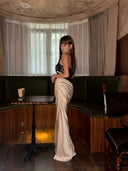 VOGSION Noctelle black and ivory strapless mermaid gown, full side profile