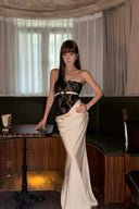 VOGSION Noctelle black lace and ivory draped satin mermaid gown, full front view