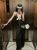 VOGSION Nocturne black and white two-piece pants set with a plunging top and wide-leg trousers in a full-length look