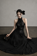 Black sequin halter maxi dress seated view