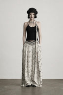 Full-length front view of ivory and black low-rise wide-leg pants