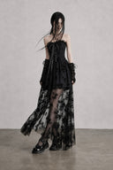Angled view of black gothic corset dress with fixed floral mesh overlay