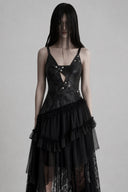 Front detail of VOGSION Nyxara black gothic asymmetrical lace dress with silver studs