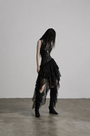 Full-length VOGSION Nyxara black layered high-low lace maxi dress styled for gothic fashion