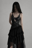 Close-up of VOGSION Nyxara studded cutout bodice and asymmetrical gothic lace maxi skirt