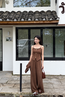 Mocha petite beaded camisole and high-waisted wide-leg pants with matching cardigan held at the side