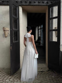 Vogsion petite ivory tulle maxi dress close-up showing corset bodice, vertical boning, high waistline, and soft white layered skirt