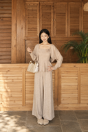 Beige petite knit three-piece set with cropped cardigan, rosette peplum camisole and wide-leg trousers