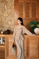 Beige Rosaline petite knit set showing the square neckline, rosette detail and peplum waist
