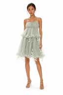 Side view of Vogsion sage green fairycore ruffle tulle dress with spaghetti straps, babydoll silhouette, and cascading leaf appliqué