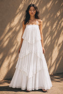 Vogsion Seraphina Tiered Chantilly Lace Maxi Dress in pure white featuring delicate Chantilly lace tiers, romantic flowing silhouette, lightweight sheer layers, elegant summer wedding guest dress, cottagecore fairy aesthetic and luxury resort style.
