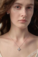 Silver tone floral CZ pendant necklace with vintage iris flower design