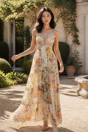 VOGSION Solenne floral maxi dress for wedding guests in a sunlit garden