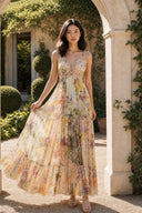 VOGSION Solenne V-neck floral maxi dress in an elegant villa garden