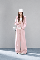 Front view of the Sorelle petite blush pink hooded jacket and high-waisted wide-leg pant set.