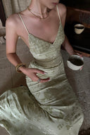 Close-up of the VOGSION Sylvie Petite Mint Garden Maxi Dress showcasing delicate floral jacquard detailing and elegant neckline.