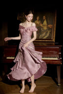Deep pink satin off-shoulder maxi dress with ruched bodice and cascading ruffles, twirl view