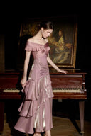 Deep pink satin ruched formal maxi dress with off-shoulder ruffle neckline, side view