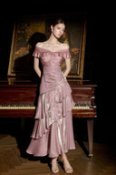 Deep pink satin wedding guest maxi dress with off-shoulder neckline and tiered ruffles, front view
