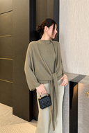 Olive two-piece sweater set with cardigan tied at the front, side-facing view